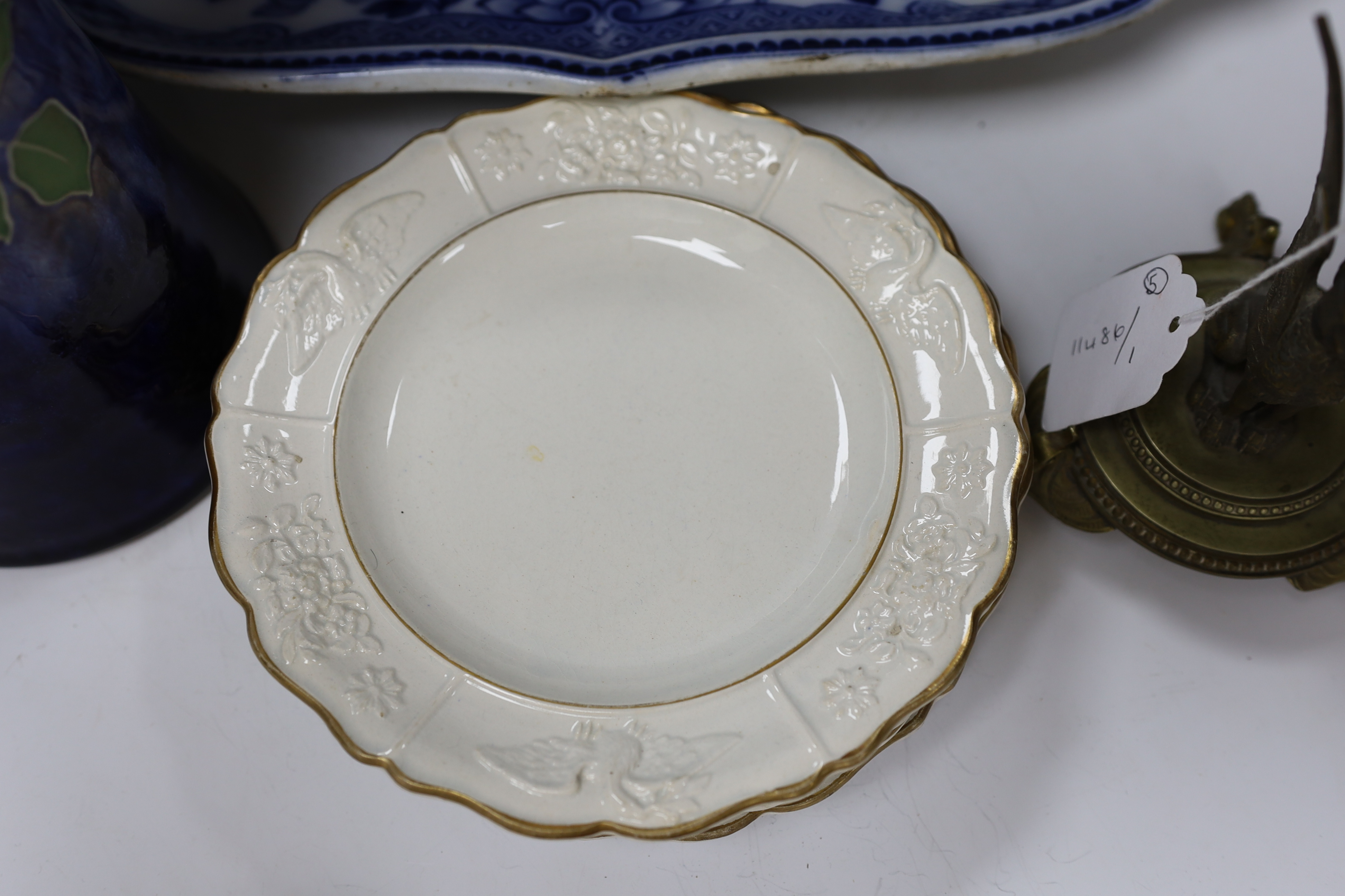 A Flow blue and gilt decorated bowl, a blue and white meat platter, a Royal Doulton vase, a gilt Egyptian inspired centrepiece and set of six gilt bordered plates
